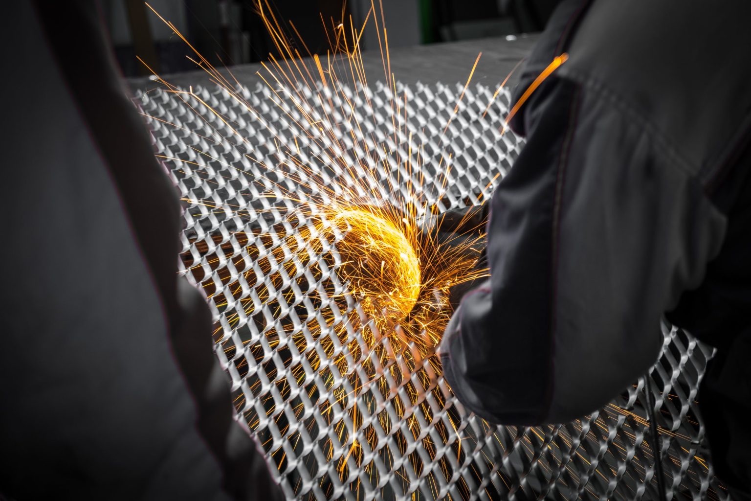 Expanded metal sheet being cut in a workshop