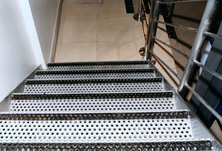 Staircase with perforated metal treads