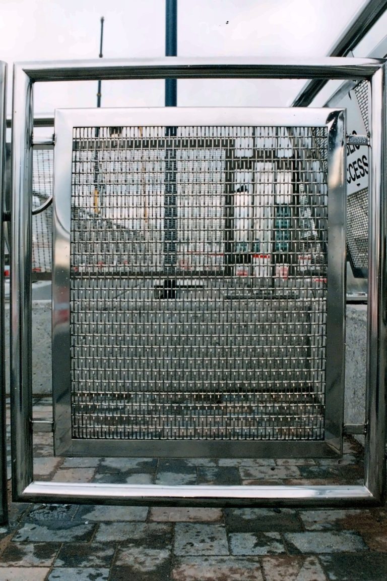 Lift shaft enclosed in woven wire mesh