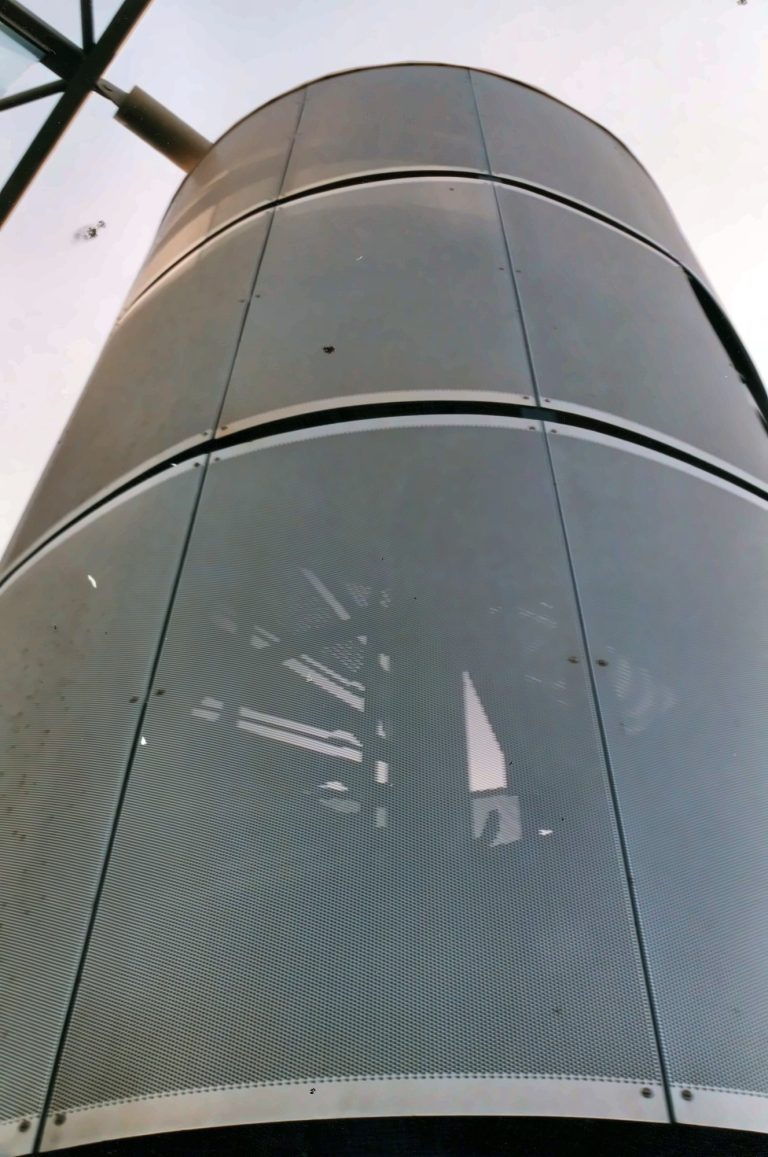 Curved perforated metal cladding