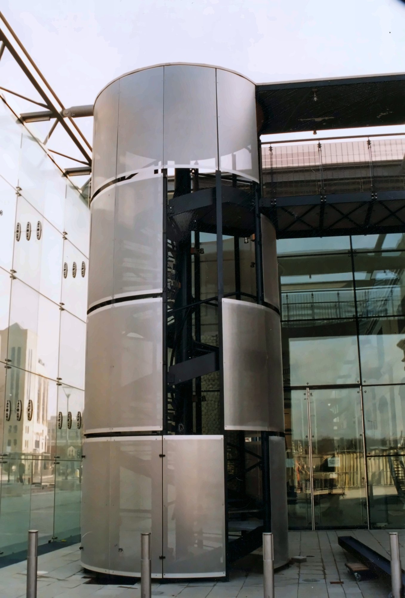 Perforated metal cladding around a stair tower