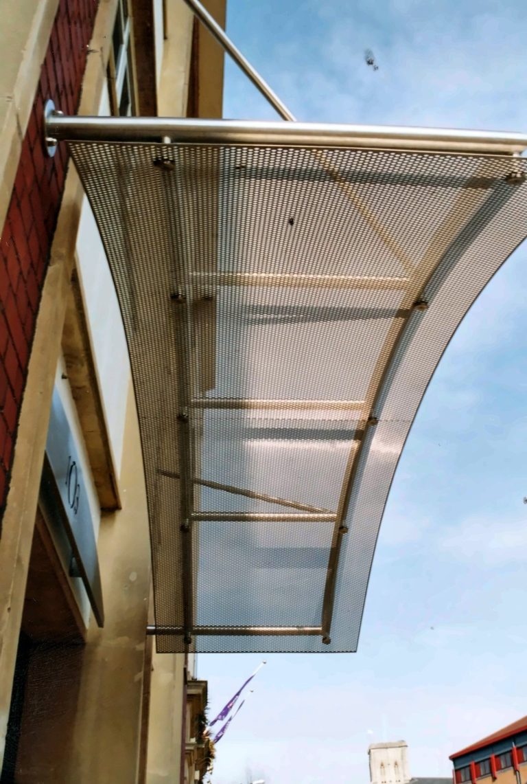 Curved perforated metal screen