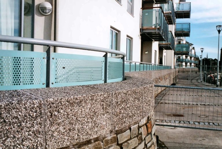 Perforated metal balustrade by the waterside