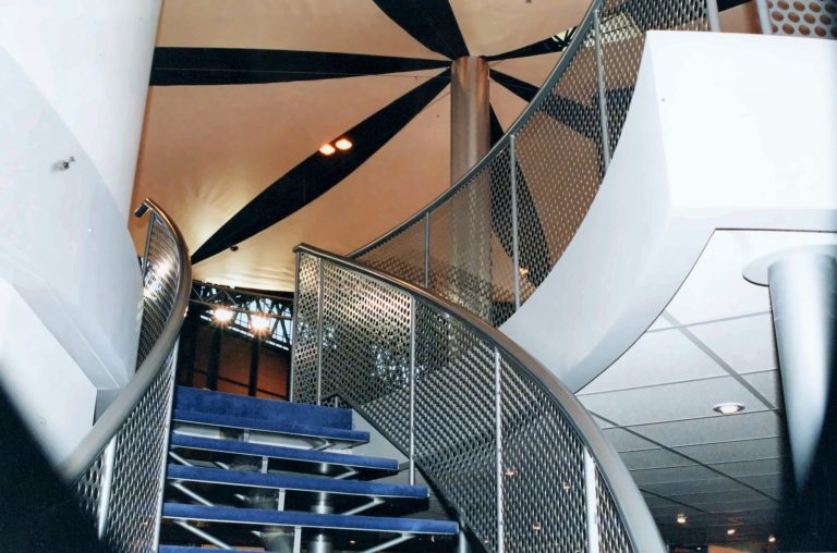 Spiral stair with perforated metal balustrade